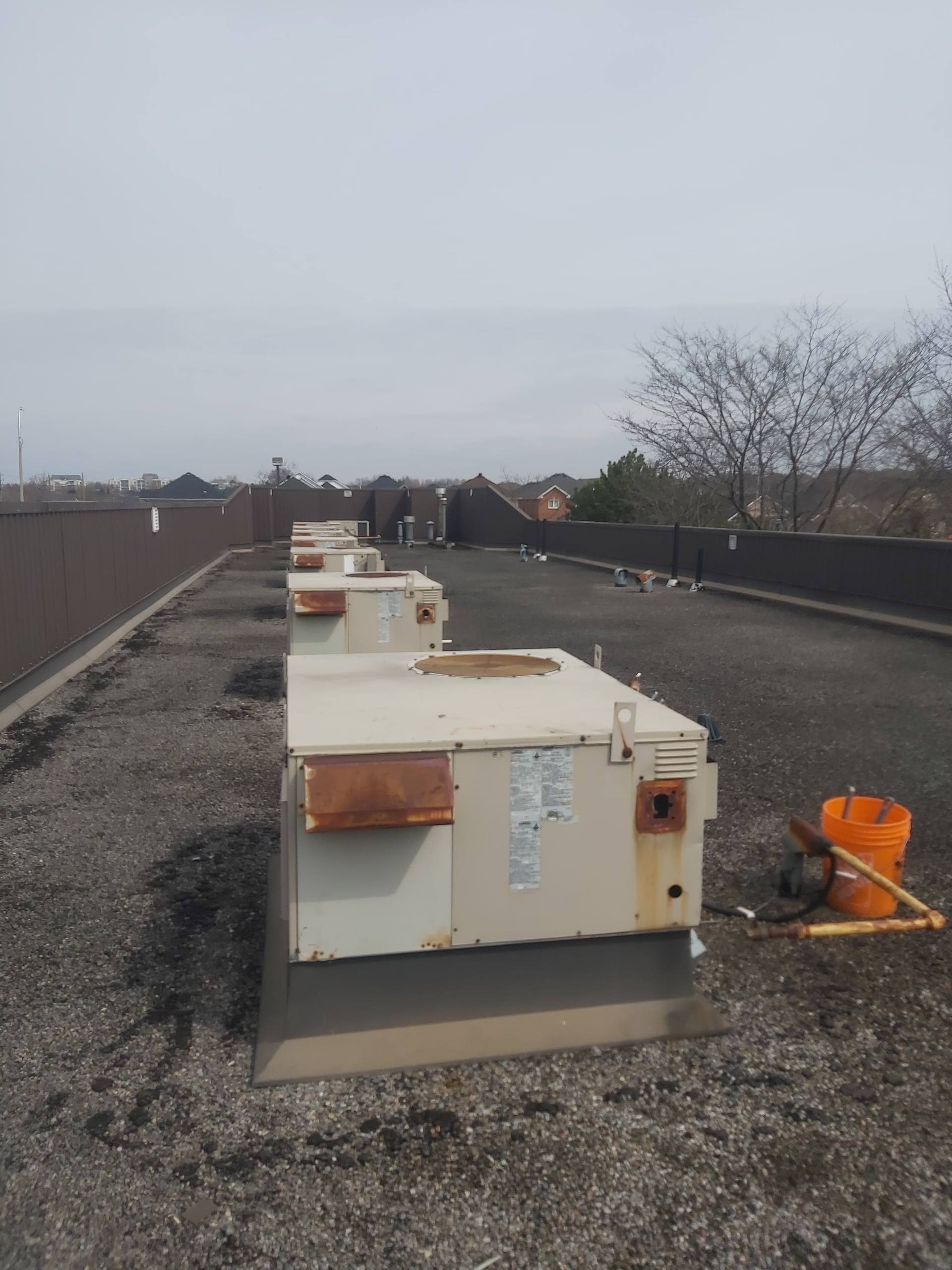 Commercial rooftop unit inspection and service by OLU HVAC.