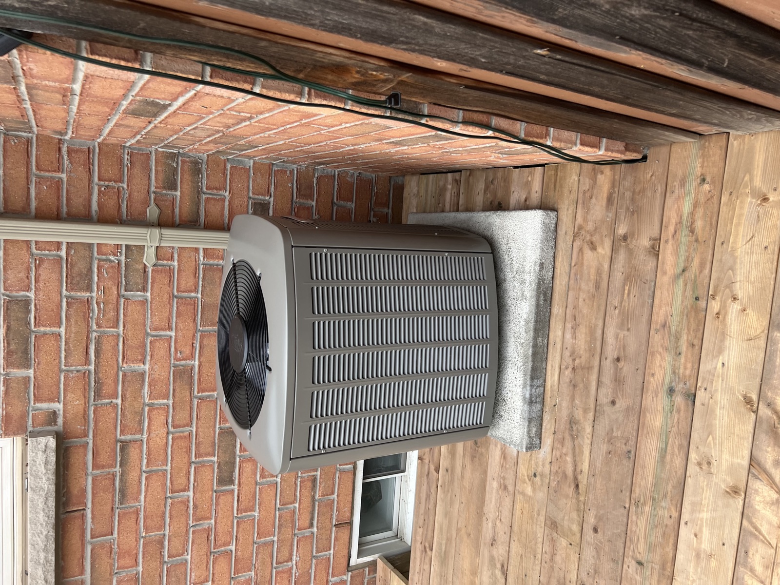 Residential outdoor AC equipment checked by OLU HVAC.