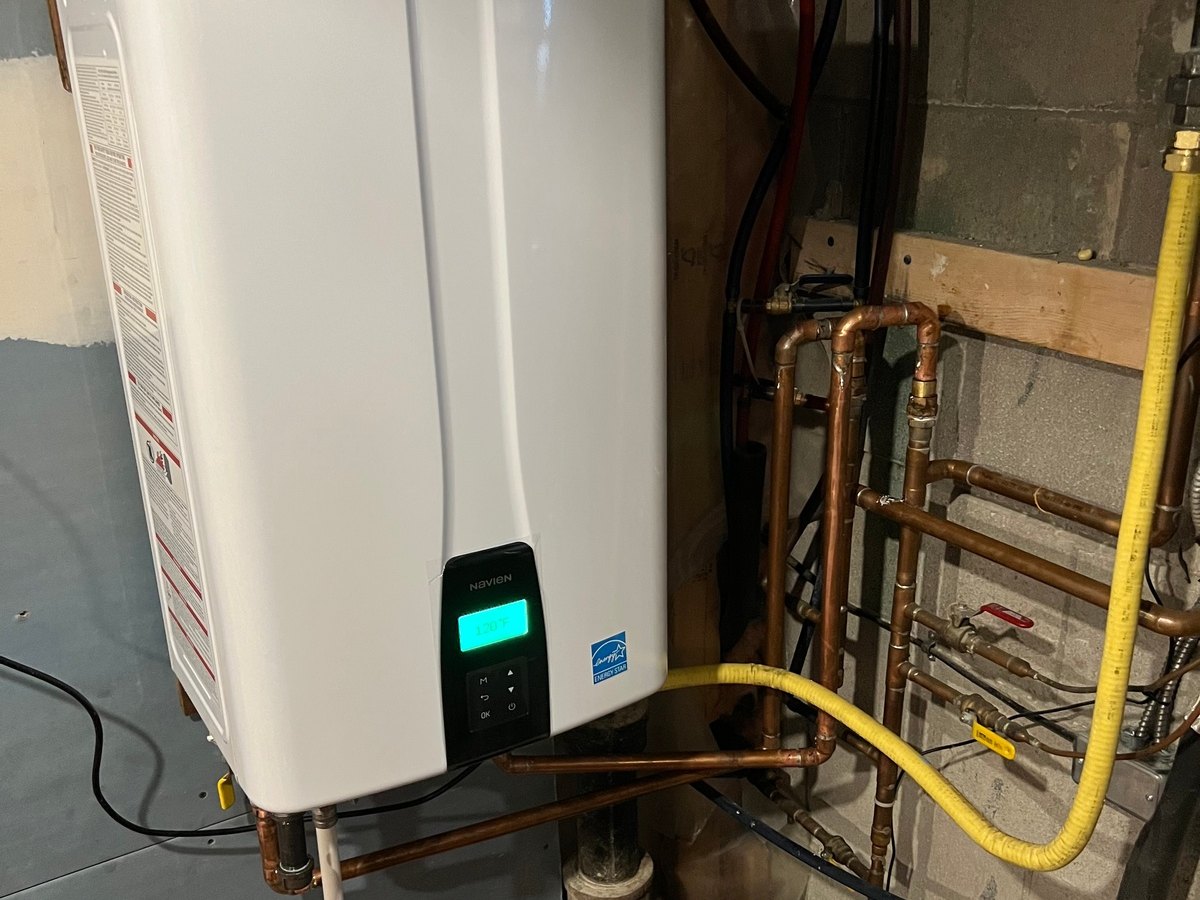 Tankless water heater installation and venting setup.