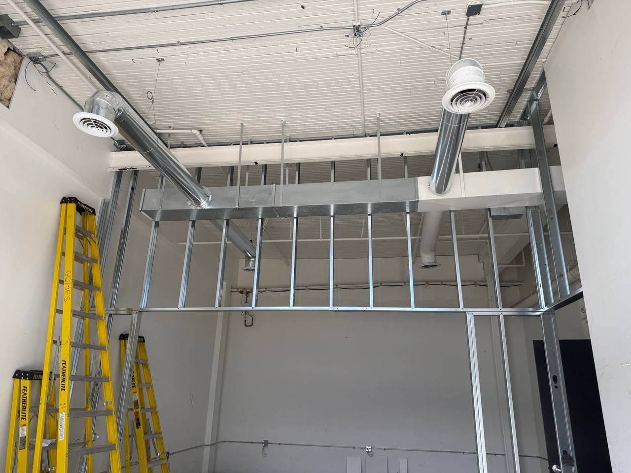 Commercial rooftop unit service in winter conditions.